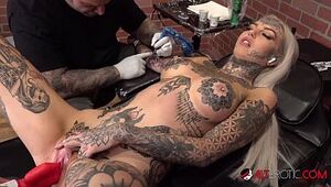 Amber Luke drains while getting tatted
