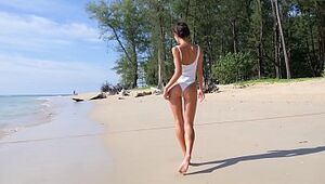 Marvelous nubile on a beach taunting with her caboose in one lump bathing suit